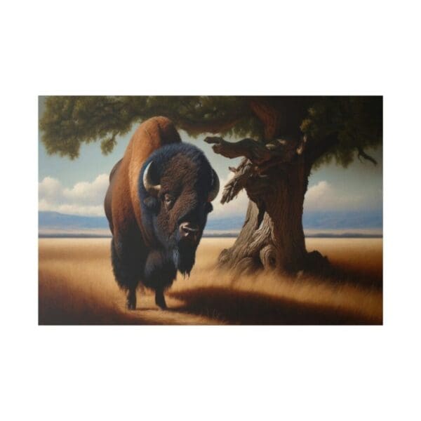 A large bison stands near a tree.