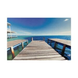 Wooden pier leading to blue ocean.