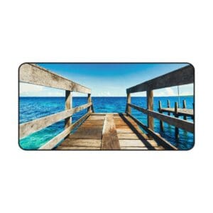 Wooden pier extending into the blue ocean.