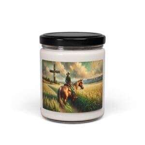 Candle jar with cowboy and horse artwork.