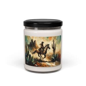Candle jar with cowboy desert scene label.