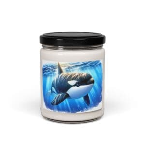 Candle jar with orca illustration label.