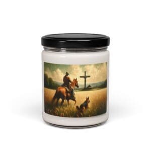 Candle with cowboy and cross scene label.