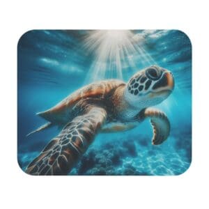 Sea turtle swimming under sunlit water.